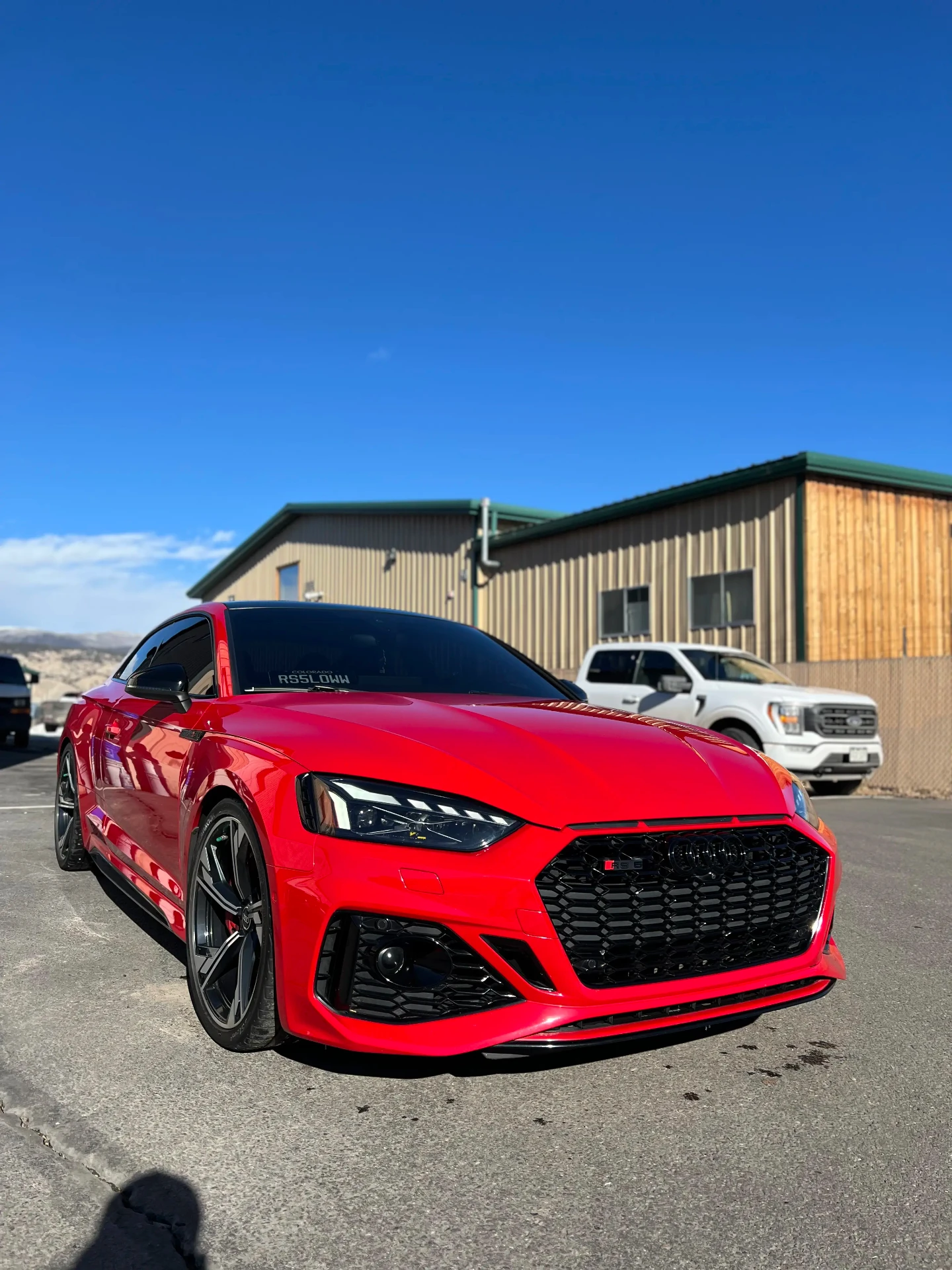 Red Audi RS5 with a freshly detailed, high-gloss paint finish outside the Gypsum studio